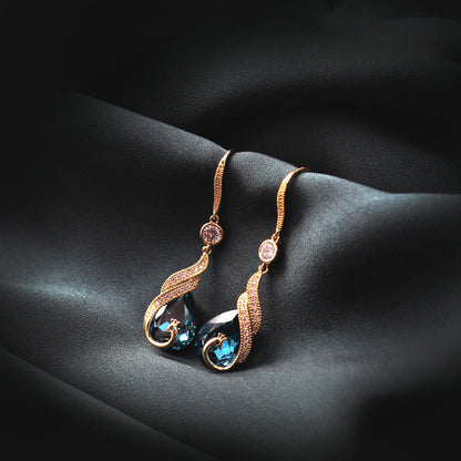 ✨ ¡50 % DE DESCUENTO POR TIEMPO LIMITADO! 🦚 Pendientes Phoenix: diseño de pavo real, piedras de circonita, ligeros, ideales para regalar 🎁