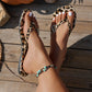 Chanclas con estampado de leopardo y charm de corazón