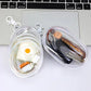 Estuche transparente con llavero